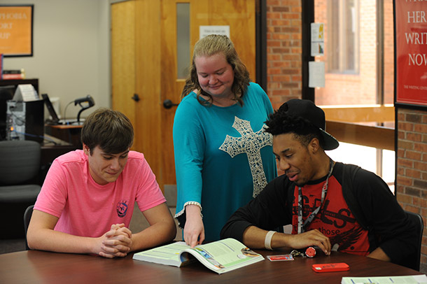 Image of students getting help in the Writing Center