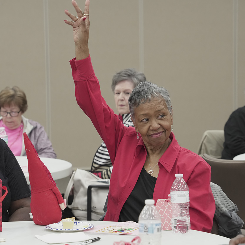 Lady with hand raised